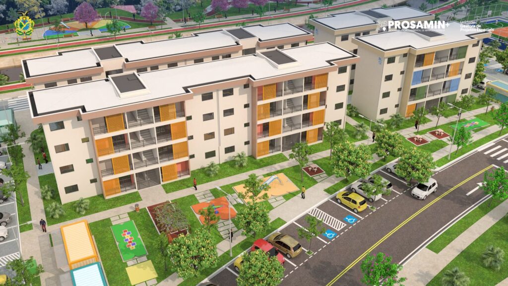 Aerial view of a modern apartment complex in an urban area, featuring three buildings, parking spaces, green landscaping, and outdoor play areas alongside a city street.