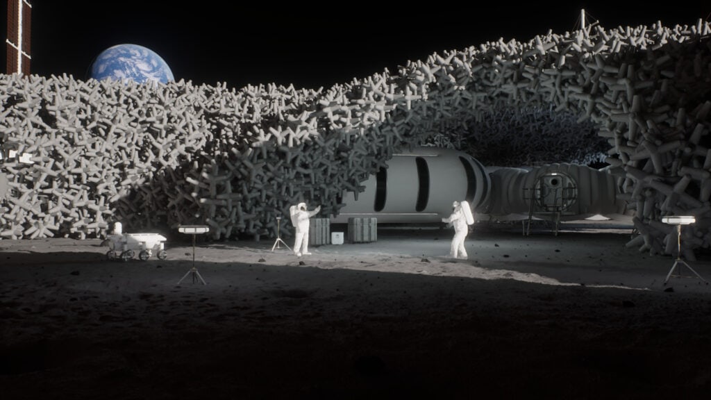 Astronauts work outside a futuristic lunar habitat with a modular, lattice-like structure on the Moon; Earth is visible in the background.
