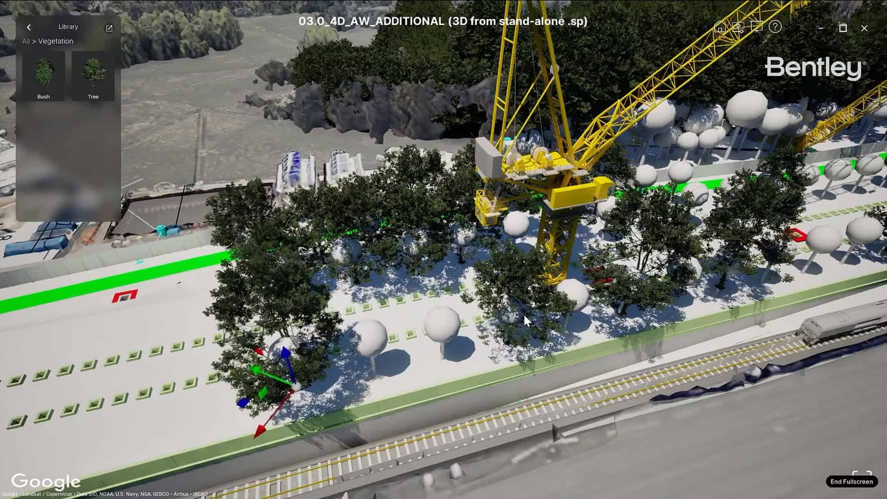 A digital rendering of a construction site features a large yellow crane, numerous trees, and spherical objects, situated alongside a multi-lane roadway.