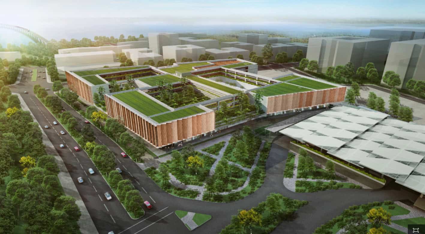 Conceptual rendering of a modern eco-friendly campus with green roofs, solar panels, and surrounded by lush greenery.