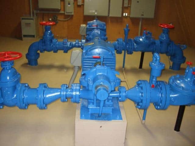 Blue industrial pipeline with valves and fittings
