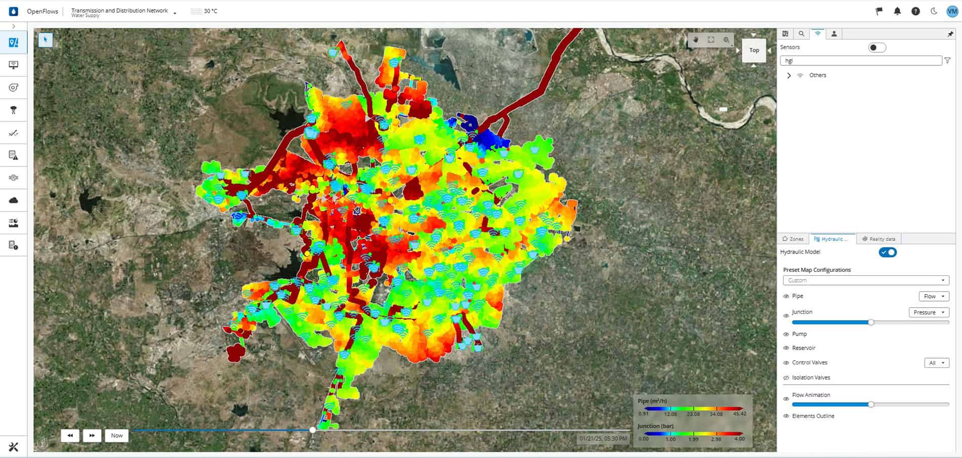 Satellite map showing a city with overlaid colored data points and heatmap, visualizing various measurements from blue (low) to red (high), and highlighting insights from the urban area's water network using a digital twin model.