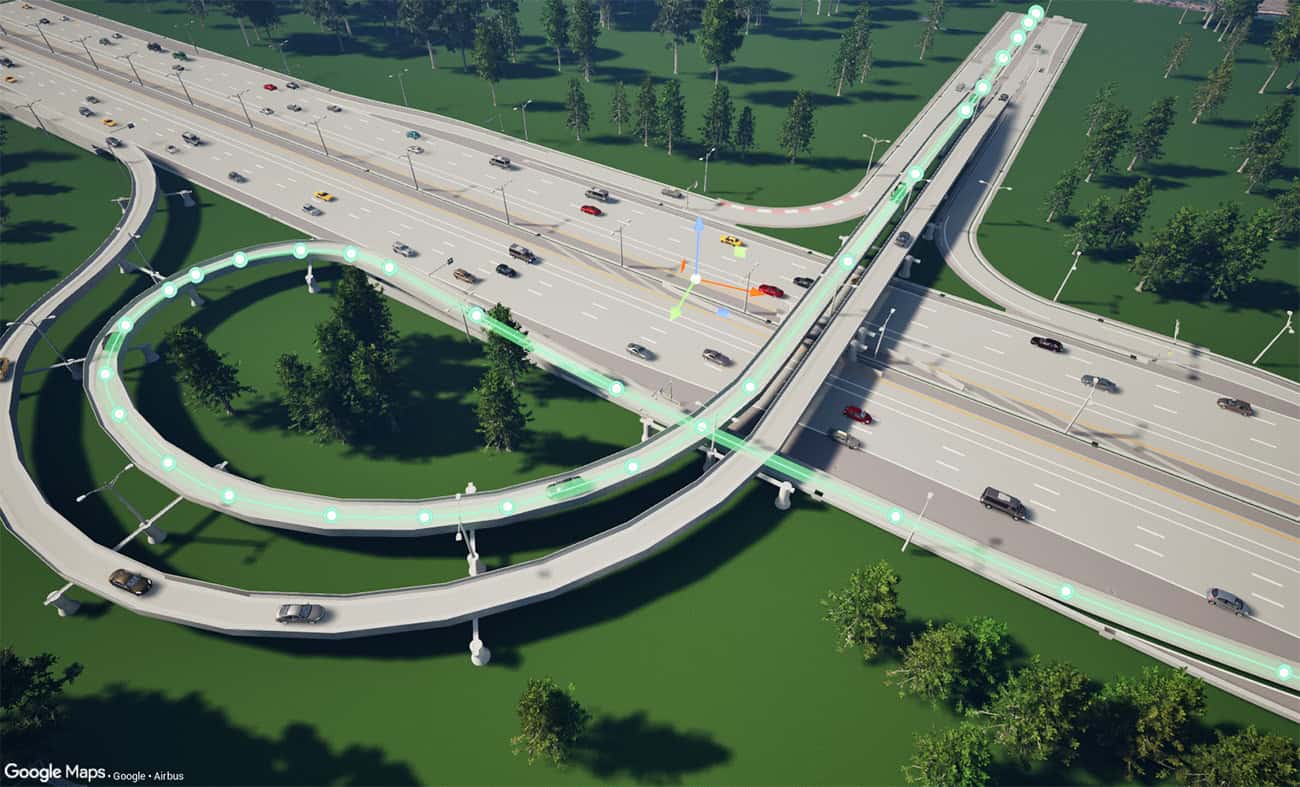 Aerial view of a multilane highway interchange with looping ramps, overpasses, cars, and surrounding green areas with scattered trees—evoking the clarity of visualizing connected data to make confident decisions.