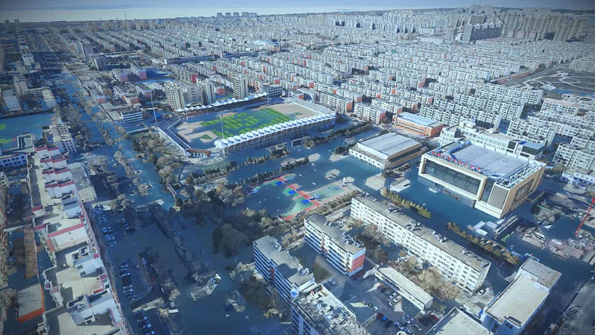 Aerial view of a city in Northwest China with partially flooded streets and buildings, including a stadium, residential blocks, and commercial areas, showcasing the need for smart flood control through digital innovation.