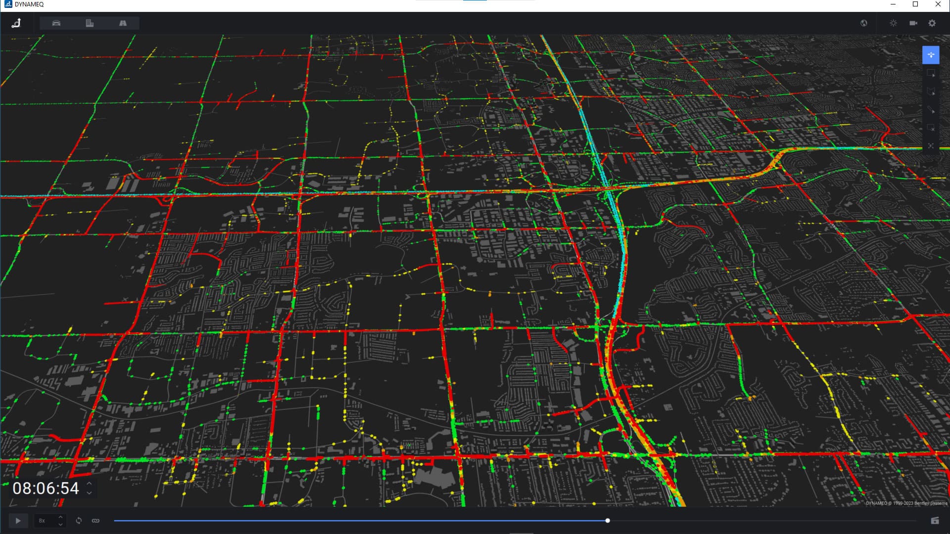 A digital map displays city streets with color-coded traffic data: green for light, yellow for moderate, and red for heavy congestion, along with a timestamp in the bottom left corner.