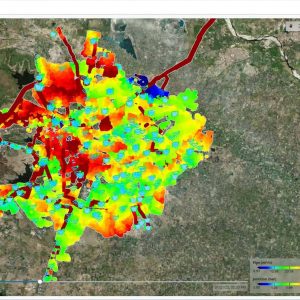 Satellite map showing a city with overlaid colored data points and heatmap, visualizing various measurements from blue (low) to red (high), and highlighting insights from the urban area's water network using a digital twin model.