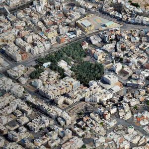 Aerial view of a densely built urban area in the Madinah smart city, with roads, buildings, and a patch of greenery; an overlay displays "B Winner 2025" in the bottom left corner.