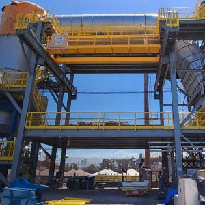 A large industrial facility, possibly a green briquette plant, with metal structures, pipes, and yellow railings under a clear sky; a āB Winner 2025ā badge is visible in the lower left corner. A large industrial facility, possibly a green briquette plant, with metal structures, pipes, and yellow railings under a clear sky; a āB Winner 2025ā badge is visible in the lower left corner.