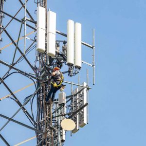 utility worker on communication tower