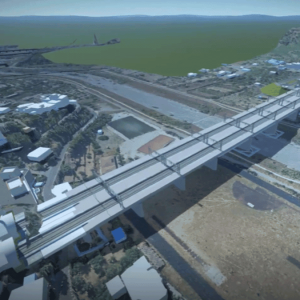 Digital rendering of a large bridge under construction, spanning a wide river valley with surrounding infrastructure and hills, showcases Italferr’s advanced YII Project management and SYNCHRO digital modeling tools. Digital rendering of a large bridge under construction, spanning a wide river valley with surrounding infrastructure and hills, showcases Italferr's advanced YII Project management and SYNCHRO digital modeling tools.