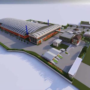 PT Wijaya Karya Aerial view of an industrial facility with a large warehouse, multiple smaller buildings, parking areas, and greenery within a fenced perimeter.