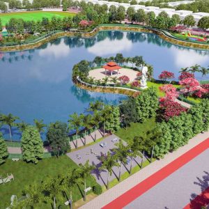 A landscaped park in Atal Puram Township features a large lake, walking paths, trees, a pavilion, and sculpture; a “B Winner 2025” badge by Voyants Solutions appears in the lower left corner. A landscaped park in Atal Puram Township features a large lake, walking paths, trees, a pavilion, and sculpture; a "B Winner 2025" badge by Voyants Solutions appears in the lower left corner.