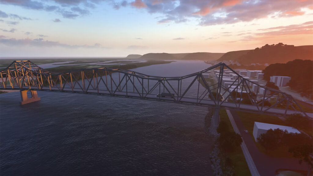 A steel truss bridge, designed with digital delivery methods, spans a wide river at sunset, with vehicles crossing and buildings visible along the shoreline.