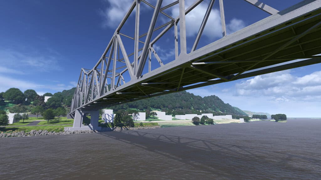 A large steel truss bridge, featuring innovative bridge design, spans a wide river, with green hills and trees on both banks under a partly cloudy sky.