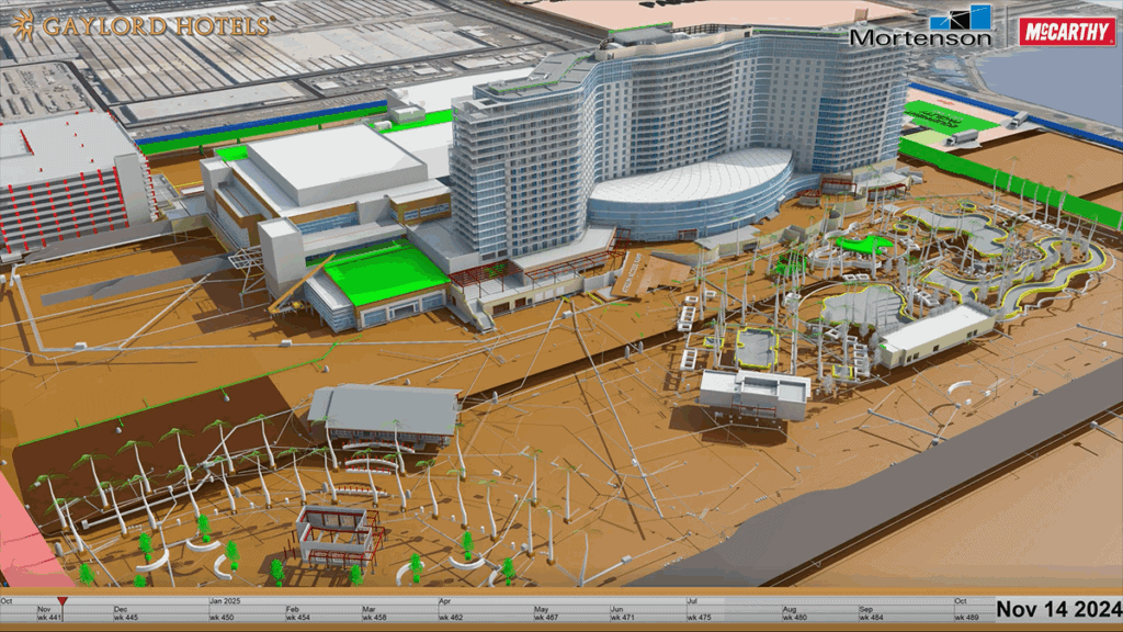 Digital rendering of the Gaylord Hotels complex under construction, featuring a large curved hotel building, adjacent structures, and a detailed outdoor area dated Nov 14, 2024.