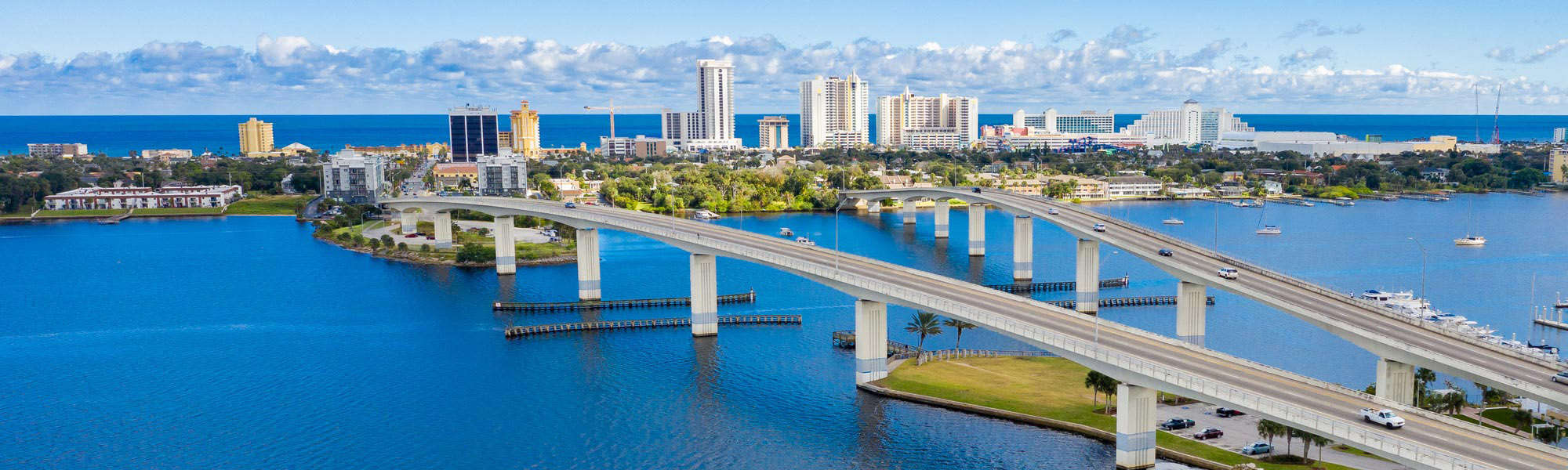 Drone angle view of Daytona Beach skyline and bridges