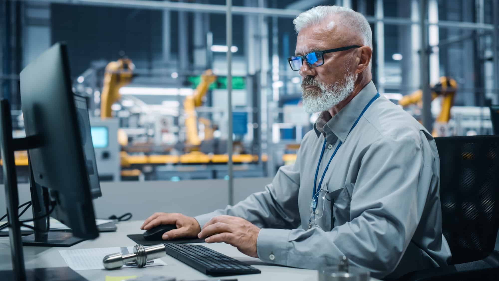 man working at a computer screen