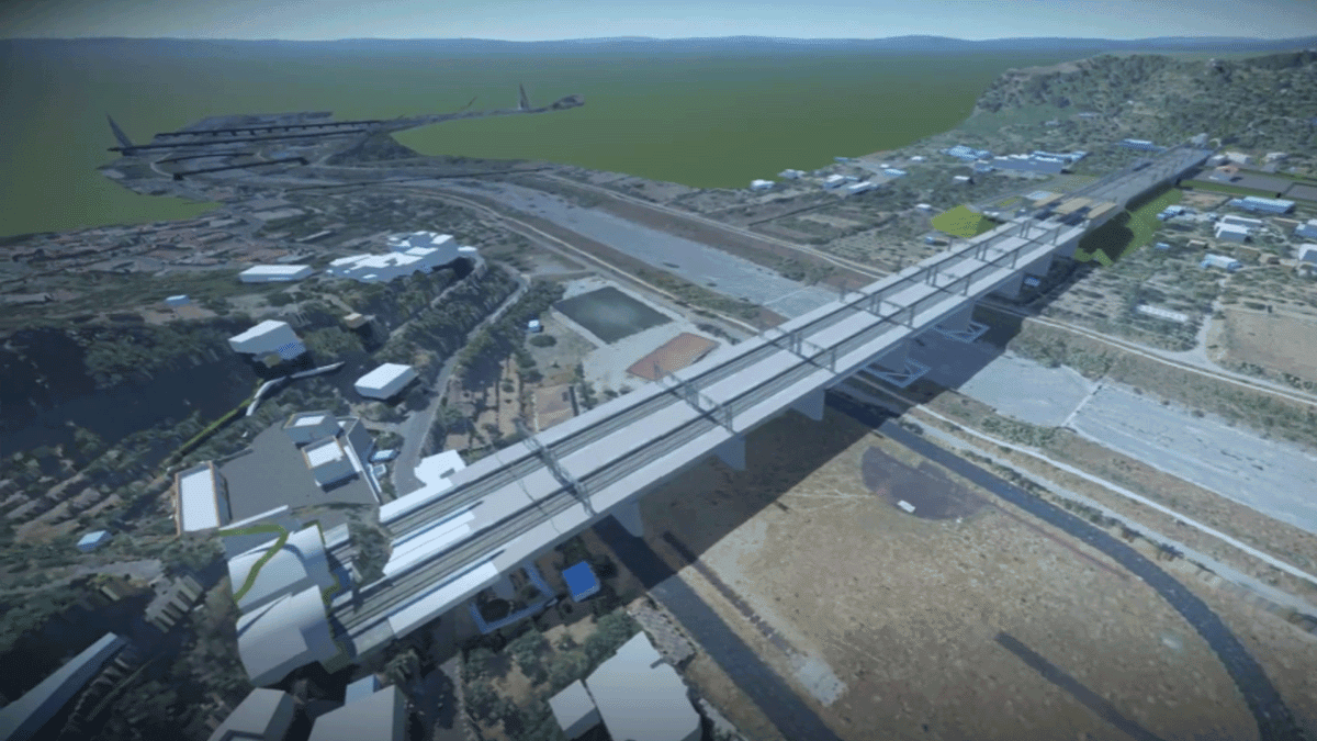 Digital rendering of a large bridge under construction, spanning a wide river valley with surrounding infrastructure and hills, showcases Italferr's advanced YII Project management and SYNCHRO digital modeling tools.