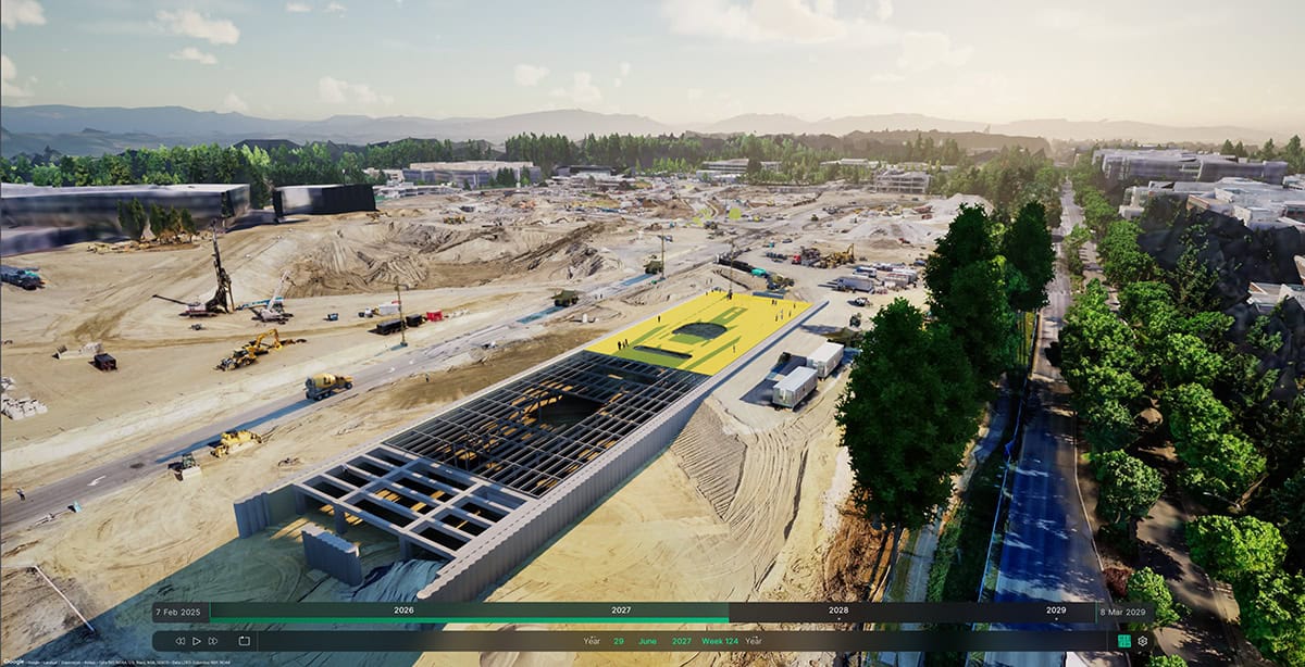 Aerial view of a large construction site with cranes, equipment, and a partially built structure in progress, surrounded by trees and roads—designed to support future infrastructure plans with precision.