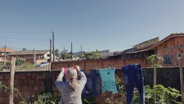 Photo of a woman hanging laundry