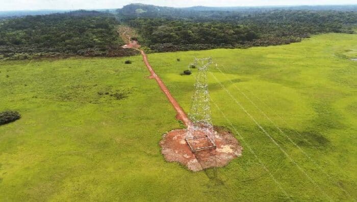 Aerial view of a single high-voltage transmission tower in Cameroon.