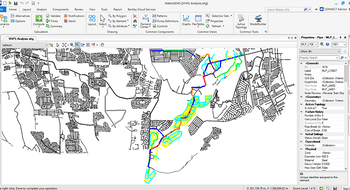 A computer screen displays a GIS software interface with a black-and-white map and colored lines representing analyzed water infrastructure, highlighting the importance of designing for efficiency in water distribution networks.