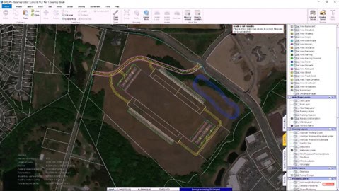 A satellite map on a computer screen displays a large building plot with surrounding roads and terrain. Using OpenSite Designer, the map includes several layers shown on a panel to the right, along with various infrastructure design tools in the top toolbar.