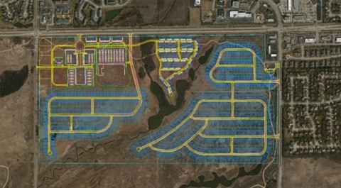 Aerial view of a planned community layout, expertly transforming residential areas, roads, and infrastructural elements in a semi-urban landscape using OpenSite Designer.