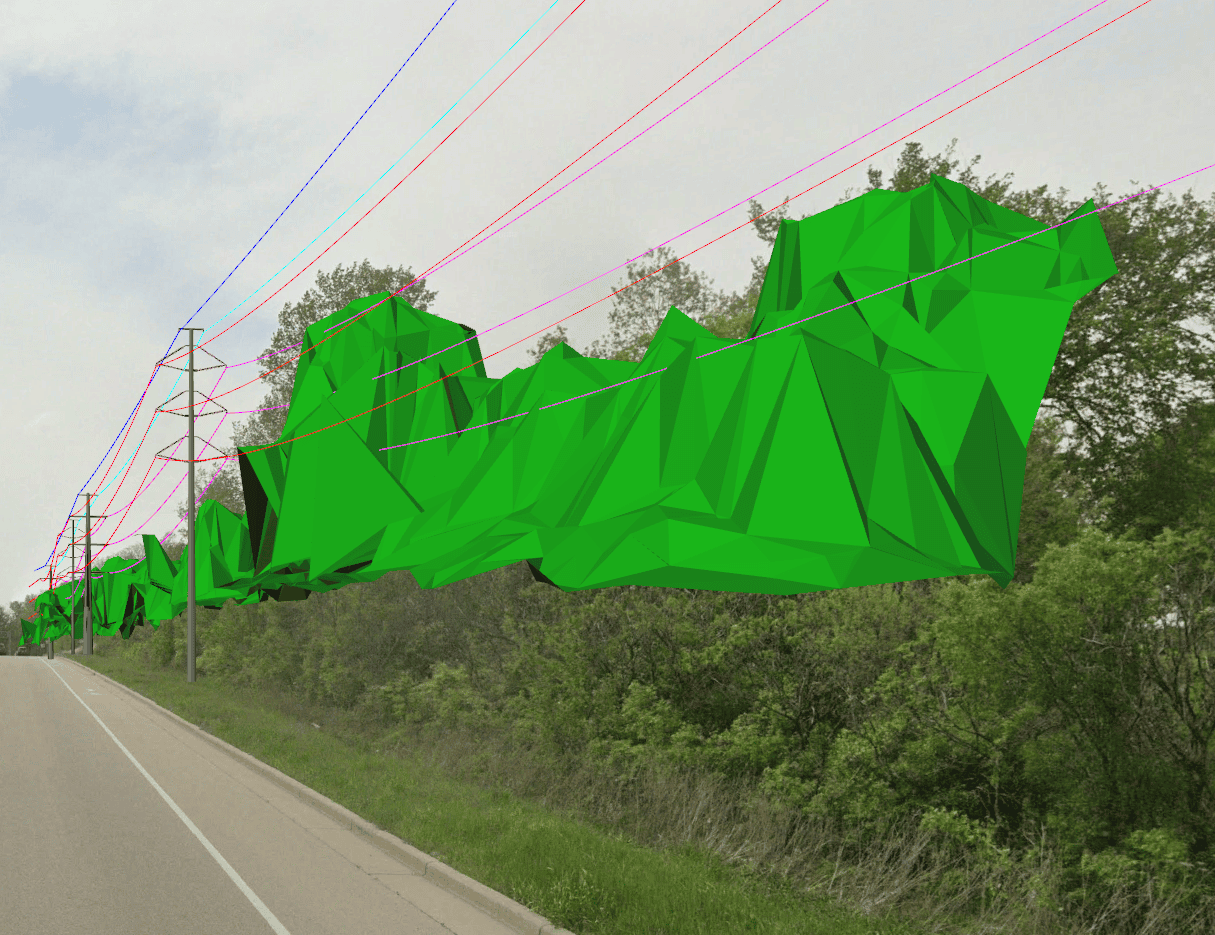 Green 3D polygons overlay trees beside a road, illustrating where vegetation intersects with America power line clearance zones—showcasing how tech helps build safer, more efficient infrastructure.