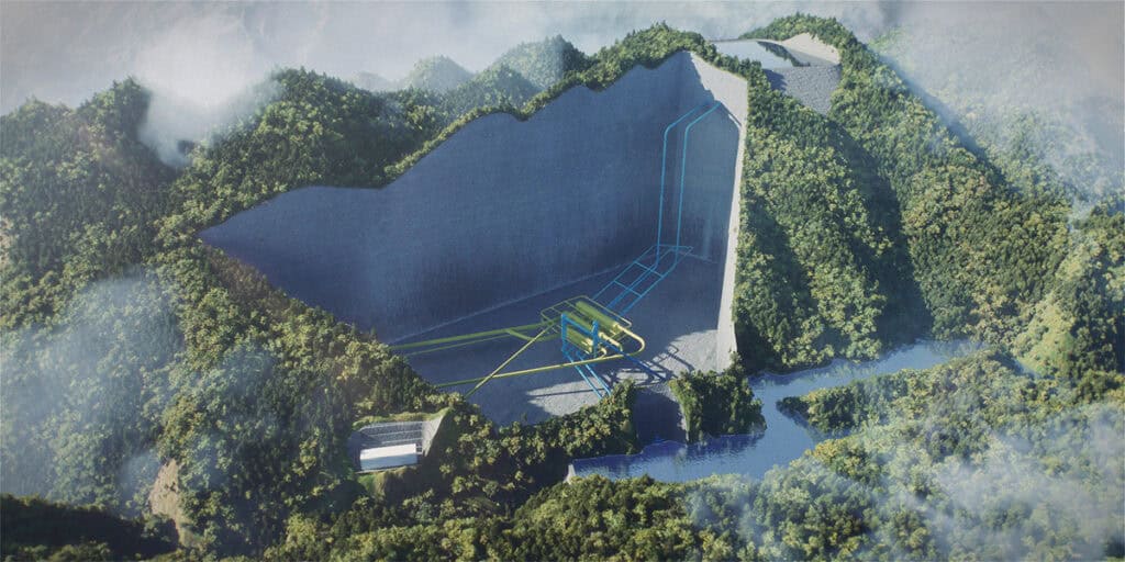 Aerial view of a large hydroelectric dam in Southwest China with pipes and infrastructure, surrounded by dense green forest and mountains, showcasing clean energy production amid complex geology.