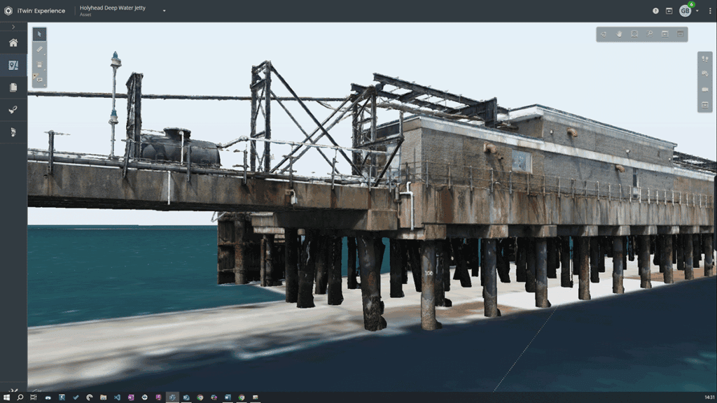 A 3D digital model of an old, weathered pier structure extending over water, shown in a modeling software interface, inspired by the Holyhead Jetty inspection.