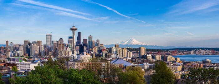 Panorama view of Seattle downtown skyline and Mt. Rainier, Washington.