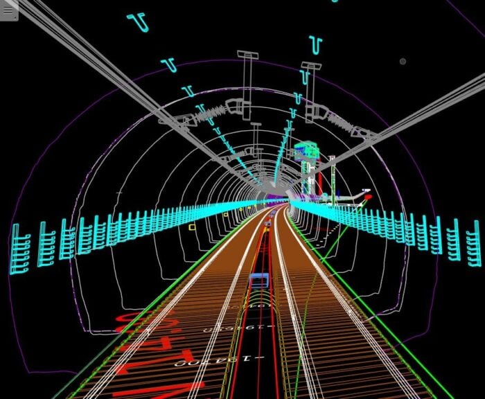 A 3D digital model of a railway tunnel, showing tracks, tunnel walls, and overhead wiring in various colored lines on a black background.