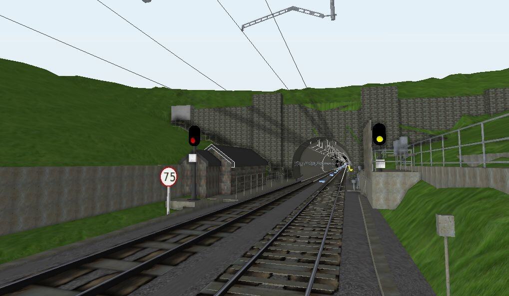 Railway tracks lead into a tunnel through a grassy hillside, with a 75 speed limit sign, signal lights, and overhead wires visible.
