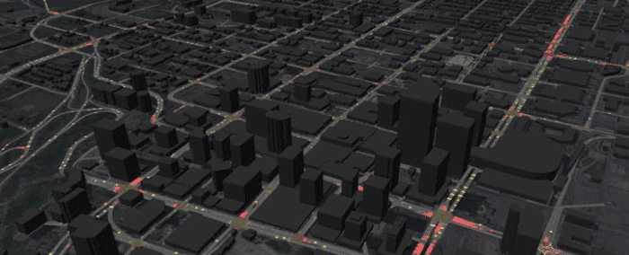 3D map of a city with dark building shapes and illuminated red and yellow lines depicting traffic flow on major roads and intersections.