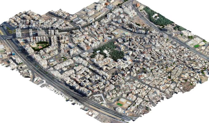 Aerial view of Madinah’s densely populated urban area with tightly packed buildings, roads, and greenery highlights the city’s transformation into a smart city.