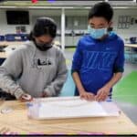 Two students working on project
