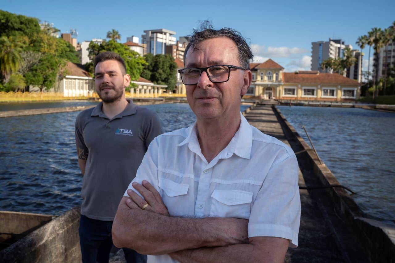 Photo of two people standing near water|Photo of Author|Picture of Porto Alegre