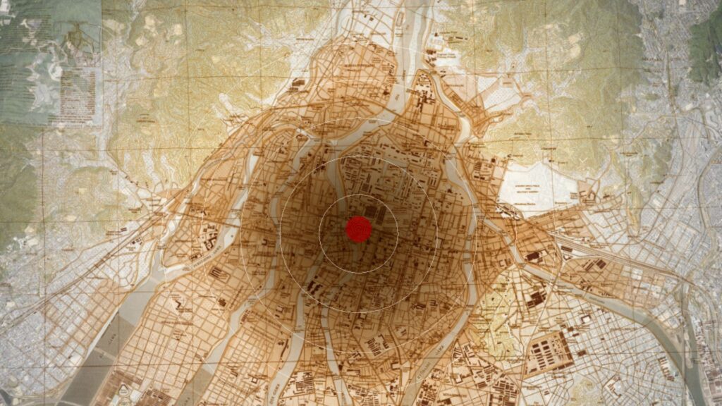 Map showing a city with a red dot at the center, surrounded by concentric circles indicating a central impact or focal point.
