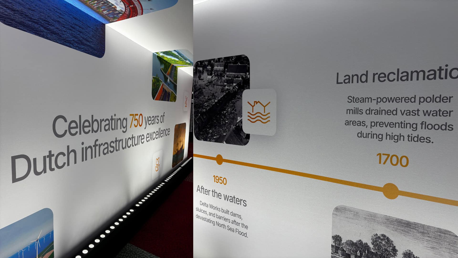 A museum exhibit wall displays a timeline highlighting 750 years of Dutch infrastructure, featuring land reclamation and flood prevention from 1700 and 1950, enhanced with immersive experiences to bring historic infrastructure plans to life.