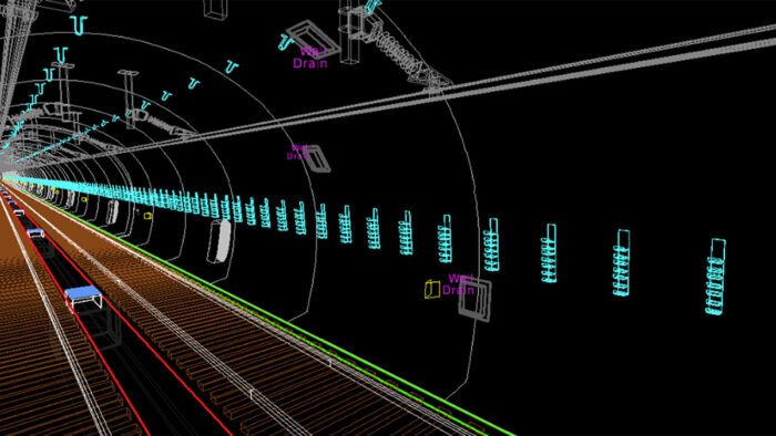 3D model rendering of the Severn Tunnel interior showing rail tracks, drainage systems, and technical wall fixtures, with colored lines indicating various infrastructure elements for digital twin analysis.
