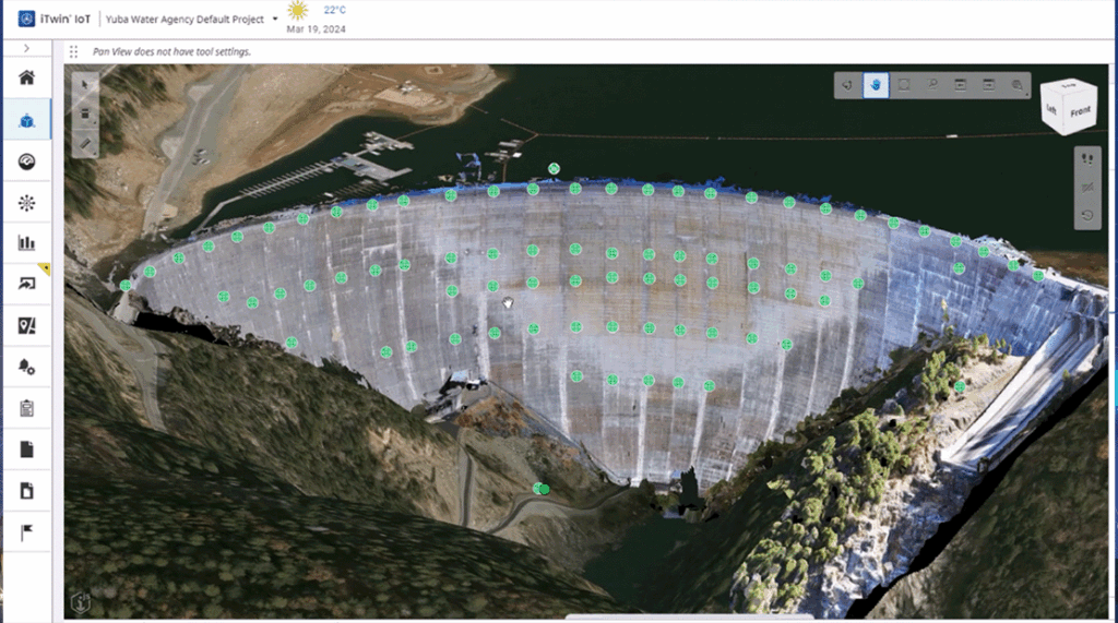 3D aerial view of a large concrete dam with overlaid survey points, surrounded by water and forested landscape, displayed in mapping software interface.